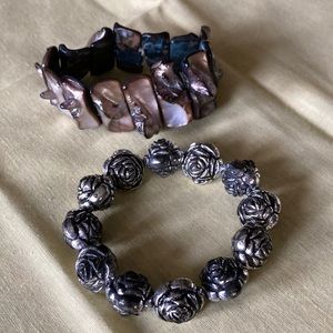 Lot-2 stretch bracelets, ST, 1 w/roses. 1 w/mop seashells lavender hue.  $15